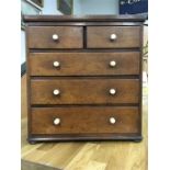 A Victorian mahogany table top chest of drawers with two small drawers over three larger graduated