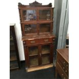 A Antique mahogany display cabinet fitted draws and cupboards