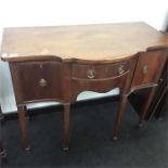 An antique mahogany Georgian design sideboard with two cupboards and a drawer.