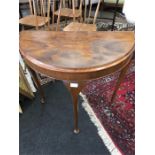 A walnut half moon occasional hall table.