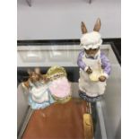 Two Beswick Beatrix Potter figures: Mrs Rabbit Baking and Hunca Munca.