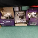 Three boxes of black and white photographs together with some slides.