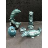 Five Poole Pottery animals in blue.