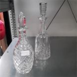 A Waterford Lismore mallet shaped wine decanter and one other.