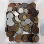 A white box of assorted coins.
