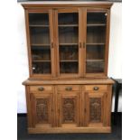 A large three panelled oak kitchen dresser unit with top glazed section.