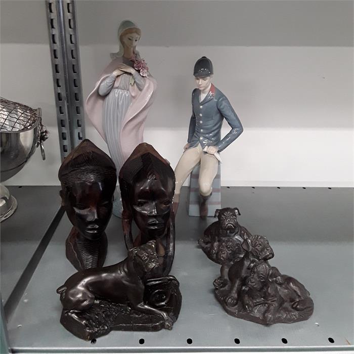 Two Lladro figures together with two wooden carved African heads and three resin bronze effect