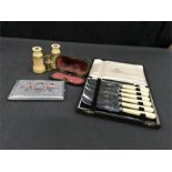 A pair of ivory opera glasses, cased, a boxed set of butter knives and an Egyptian style cigarette