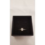 An 18 carat gold emerald cut diamond solitaire ring, approx. 0.45 point, Colour approx. i/j, Clarity