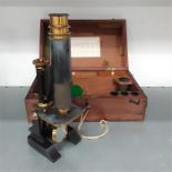 A brass mounted microscope in case by P Harris and co.