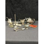 A box of silver plated items.