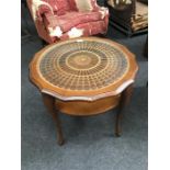 A round occasional table with decorative centre glass section.