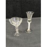 A Georgian airtwist stem wine glass with engraved bowl and a sweet meat glass with folded foot and