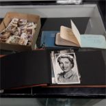 Two small autograph books together with a box of cigarette cards and an collection of signed