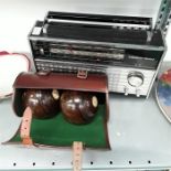 Two wooden bowls in case together with a Grundig Yacht Boy radio.