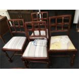 Four solid oak back chairs.