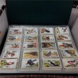 Six albums (each a complete set) of cigarette cards.