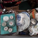 A box of china to include teapots, plates and blue and white items.