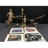 Four brass ornaments and photographs of vintage vehicles.