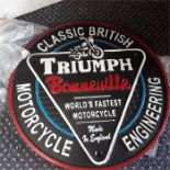 A large Triumph Bonneville sign.