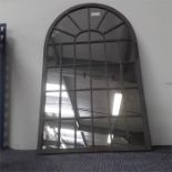 A small leaded glass mirror.
