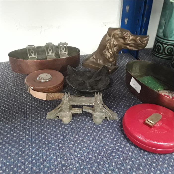 Various metal items to include a door stop depicting a dog, a metal cat, a metal London bridge, a