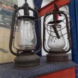 Two vintage hurricane lamps.