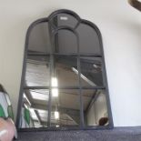 A small leaded glass mirror.