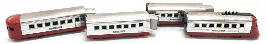 Lionel Lines O gauge early four car electric set in metal bodied chrome and red.