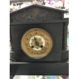 A black slate mantel clock.