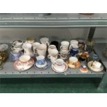 A large quantity of china cups and saucers, Coronation mugs, jar of coins etc.