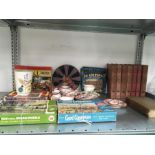 A mixed lot of books, jigsaw puzzles and china.