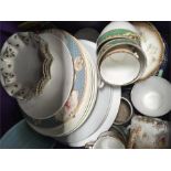 A box containing an assortment of chinaware