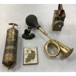 A collection of metal items including a vintage horn, lamp and fire extinguisher