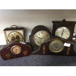 A collection of mantle clocks.