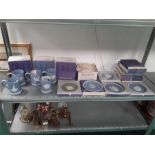 A large quantity of Wedgwood plates and mugs, mainly boxed.