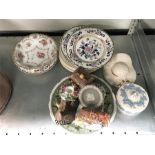 An assortment of china plates and ornaments.