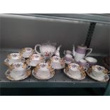 A quantity of Aynsley cups and saucers with other china.