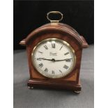 A mahogany cased mantle clock by Comitti of London.