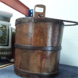 A wooden pail with metal bands and handle.