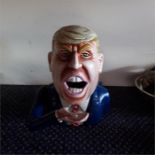 A Donald Trump money box.