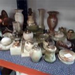 A quantity of onyx items lighters, coasters, ashtrays, vases and a lamp.