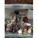 A large collection of china and glass ornaments to include Nao figure, Beswick Donkey, Doulton