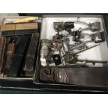 A collection of vintage cut throat razors together with other vintage hairdressing equipment.