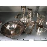 A quantity of silver plated items including a three piece teaset.