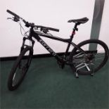 A Carrera mountain bike. 24 speed with front suspension, mechanical disc brakes and front and rear