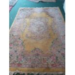 A large yellow Chinese sculpted rug