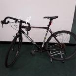 A Specialized hybrid bike. 24 speed with rear light and toe clips. Signs of wear and tear. (R69)