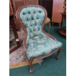 A reproduction spoon back chair.