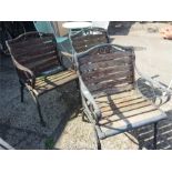 Three cast iron and teak garden armchairs.